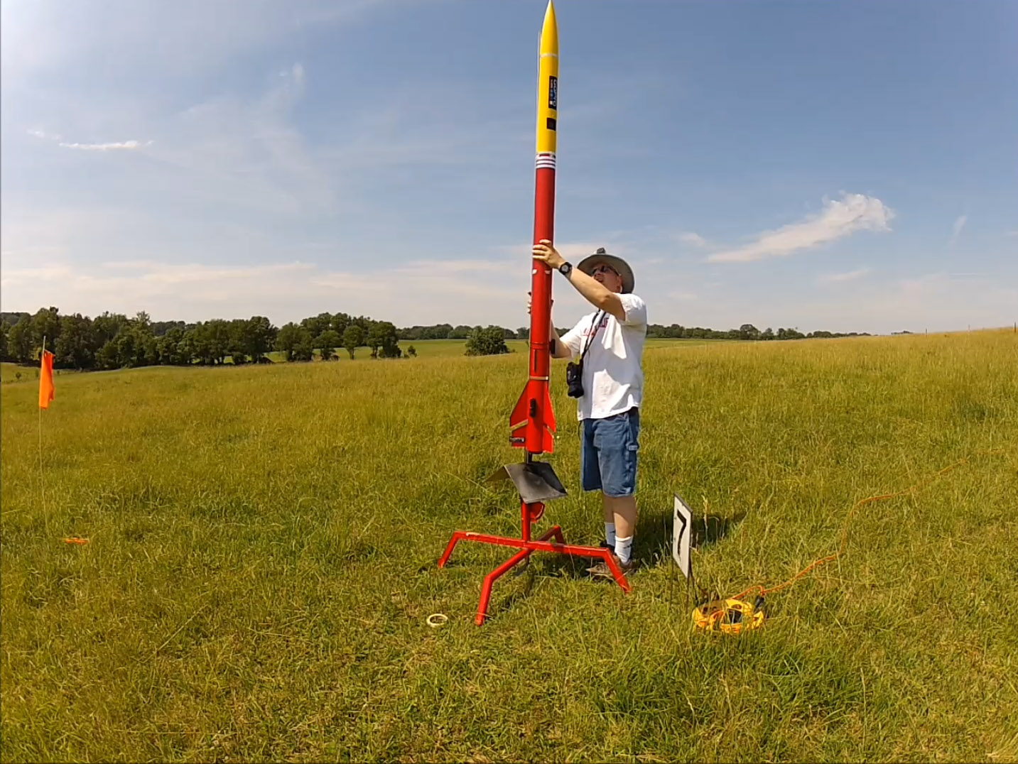 Loading the rocket on the launch pad and arming the electronics as seen from the tripod mounted GoPro Hero 2 camera. 